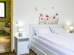Postel nebo postele na pokoji v ubytování Apartment Ca Jeanne by Interhome