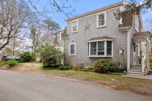 a house on the side of the road at Serene Cozy Waterfront 3 Mi to Downtown in Harwich