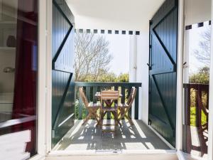 a table on the porch of a house at Apartment Maïtena by Interhome in Bidart