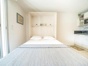 Ένα ή περισσότερα κρεβάτια σε δωμάτιο στο Apartment Le Club by Interhome