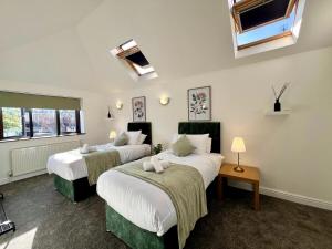 a bedroom with two beds and a window at Elegant Family Home in Prestigious Neighborhood in Olton