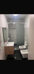 a bathroom with a sink and a toilet and a mirror at B&B San Siro in Milan +39 photos