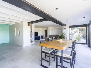 a dining room with a wooden table and chairs at Holiday Home Villa la Bergerie by Interhome in Nice +34 photos