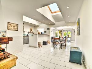 a kitchen and dining room with a table and chairs at Holiday Home La Miscandière by Interhome in Saint-Georges-dʼOléron