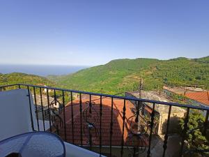 a balcony with a view of a mountain at Rivet's house in Zagora