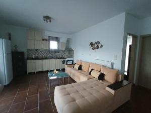 a living room with a couch and a table at Rivet's house in Zagora +44 photos