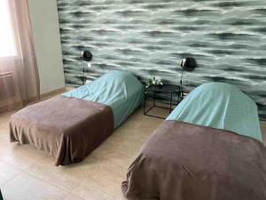 Ένα ή περισσότερα κρεβάτια σε δωμάτιο στο MAISON APPATEMENT 3 Chambres 6 couchages