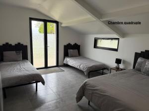 Posteľ alebo postele v izbe v ubytovaní Parc de la Charmille