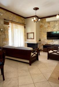 a large room with a bed and a piano at Kappa Domus in Siviri
