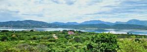 a view of a lake with mountains in the background at SOL Y LUNA 11 Apartment in Sardinia close to the beach and to Olbia airport in Olbia