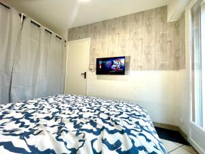 Postel nebo postele na pokoji v ubytování La détente avec jardin, sauna et parking privé au coeur de Stella-Plage