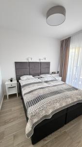 Posteľ alebo postele v izbe v ubytovaní Apartament GreyAppart