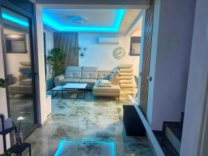 a living room with a couch and a table at Villa Nova Bar in Zaljevo