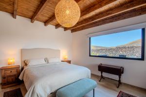 En eller flere senge i et værelse på Casa Mar de Lava -Escapada activa en Masdache, corazón de Lanzarote