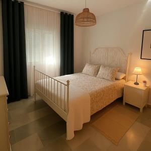 En eller flere senge i et værelse på Bombo Beach Appartement