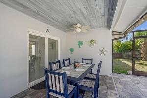 a dining room with a table and chairs at Silver Palm Retreat in Sarasota