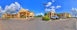 a parking lot in front of a large building at Lone Star Inn and Suites Victoria in Victoria