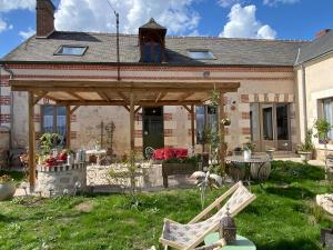 a wooden pavilion in front of a house at BENE A CASA Chambres d'hôtes in Veuzain-sur-Loire
