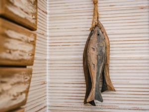 a dried fish hanging on a wall at Chalet Oystercatcher by Interhome in Spean Bridge +19 photos