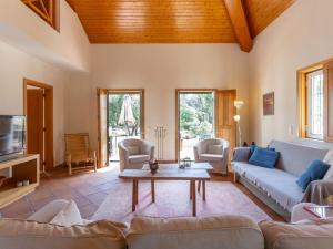 a living room with a couch and a table at Holiday Home Refúgio no Montalvo by Interhome in Alcácer do Sal +15 photos