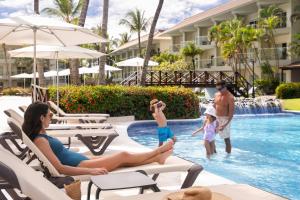 a family playing in the pool at the resort at Wyndham Alltra Punta Cana All Inclusive Resort in Punta Cana +72 photos