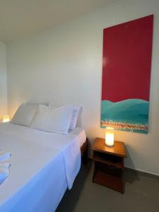 Postel nebo postele na pokoji v ubytování Bitingui Praia Hotel
