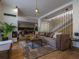 a living room with a couch and a table at Villa Vila 21 by Interhome in Bribir