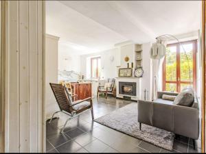 a living room with a couch and a fireplace at Apartment La Sostra by Interhome in Domaso +30 photos