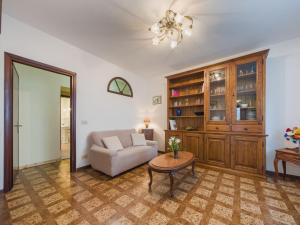 a living room with a couch and a table at Apartment Viola by Interhome in Gello +35 photos