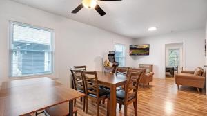 a dining room and living room with a table and chairs at Walk to Niagara Falls! 12 Bedrooms! in Niagara Falls