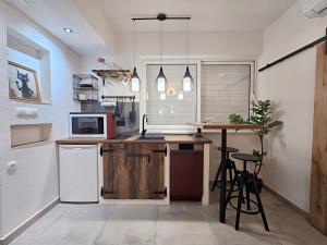 Kuchyň nebo kuchyňský kout v ubytování Apartments Marijana