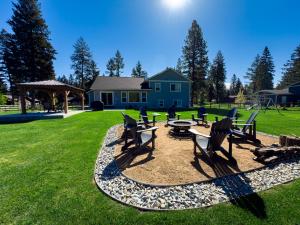 a group of chairs and a table in a yard at Timber Ridge in Columbia Falls