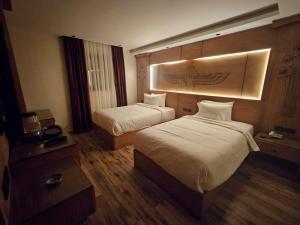 Voodi või voodid majutusasutuse Neom Pyramids Valley Boutique hotel toas