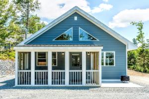 a blue house with a white front porch at Acadia Sunset Fishing Cabin #5 family beach firepit in Sullivan