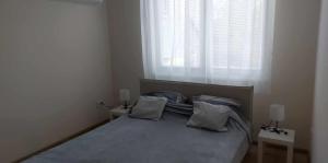 Ένα ή περισσότερα κρεβάτια σε δωμάτιο στο Konstantin Apartman +3 φωτογραφίες