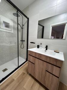 a bathroom with a sink and a shower at House Casa in Sotillo de la Adrada in Sotillo de la Adrada