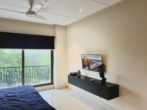 Μια τηλεόραση ή/και κέντρο ψυχαγωγίας στο Luxor Apartments & Suites - Indigo