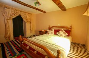 Postel nebo postele na pokoji v ubytování Adrar View Lodge