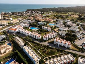 an aerial view of a resort with the ocean at Renovated Algarve Apartments with Pool in Armação de Pêra