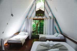 Postel nebo postele na pokoji v ubytování Calala Lodge