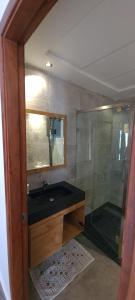 a bathroom with a sink and a shower at Appartement neuf Monte Cabo in Cabo Negro +22 photos