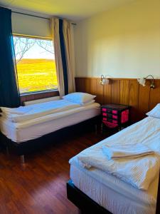 Una cama o camas en una habitación de Brú Country Estate