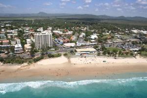 an aerial view of a beach and the ocean at Tiny Comfy flat with Bikes in Coolum Beach