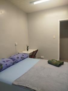 Postel nebo postele na pokoji v ubytování Pousada Central Quarto 2