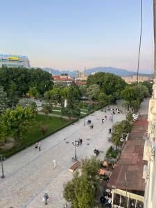 a group of people walking down a street at Temali Apartment 3 in Shkodër