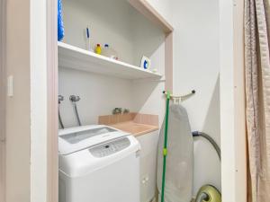 a washer and dryer in a small bathroom at Cool Waters at Horseshoe Bay in Horseshoe Bay