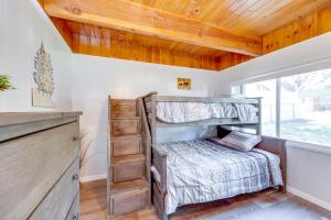 a bedroom with a bunk bed and a window at 2 Mi to Trails Modern Mountain Condo in Big Bear in Big Bear City