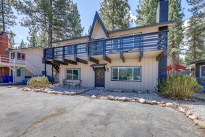 a house with a balcony on top of it at 2 Mi to Trails Modern Mountain Condo in Big Bear in Big Bear City