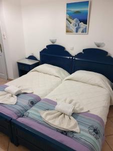 Postel nebo postele na pokoji v ubytování Hotel L&S lignos