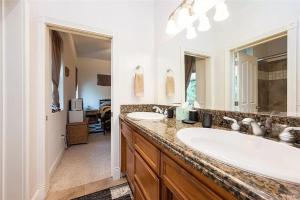 a bathroom with two sinks and a large mirror at El Tranquillo in Templeton +39 photos